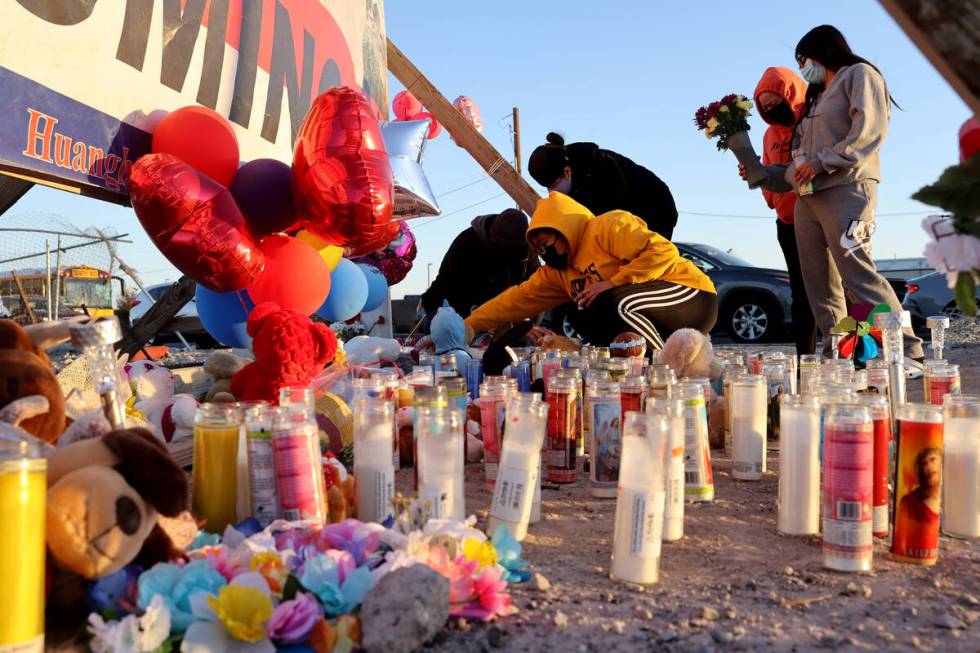 Kenia Ramos, 15, right, who was a classmate of crash victim Bryan Axel Zacarias, 15, prepares t ...