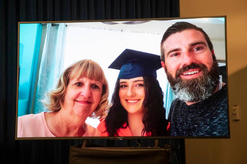 A photo of 17-year-old Mia Gugino, center, who died from a fentanyl overdose, is displayed in a ...