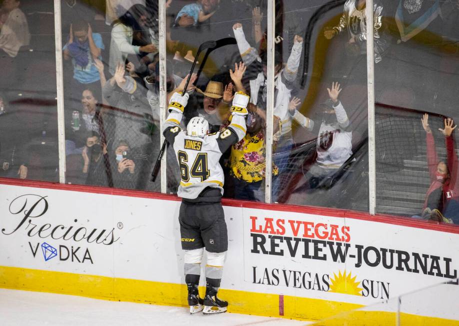 Silver Knights center Ben Jones (64) celebrates with fans after scoring a third period goal aga ...