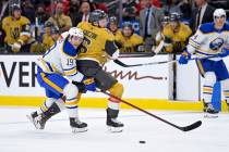 Buffalo Sabres center Peyton Krebs (19) and Vegas Golden Knights defenseman Kaedan Korczak (6) ...