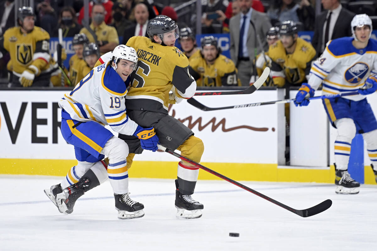 Buffalo Sabres center Peyton Krebs (19) and Vegas Golden Knights defenseman Kaedan Korczak (6) ...