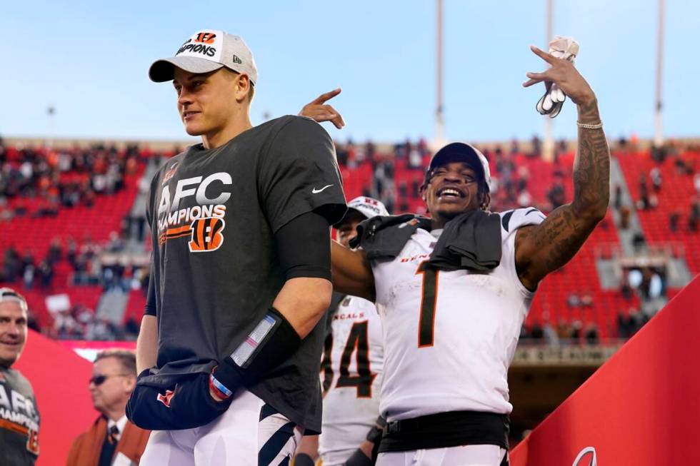 Cincinnati Bengals quarterback Joe Burrow, left, and wide receiver Ja'Marr Chase (1) celebrate ...