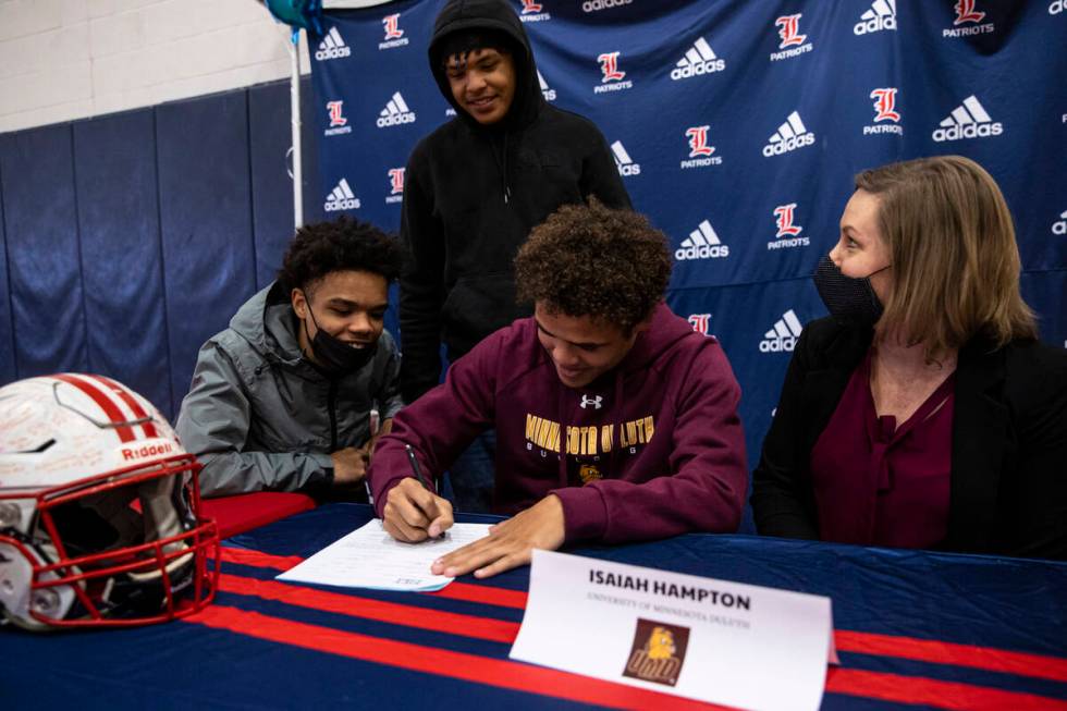 Liberty’s Isaiah Hampton signs a letter of intent to play football at University of Minn ...
