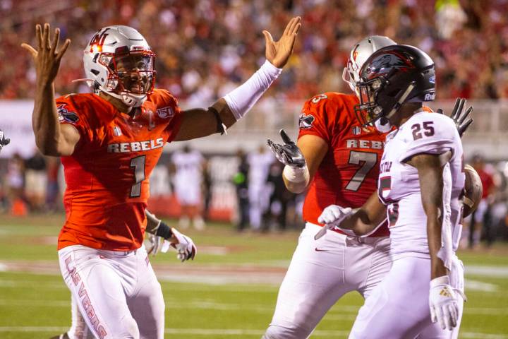 UNLV Rebels quarterback Armani Rogers (1) celebrates his touchdown over Southern Utah during th ...