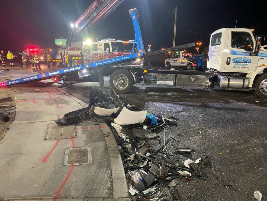 Authorities get set to tow a vehicle involved a six-car crash at the scene of a fatal crash on ...