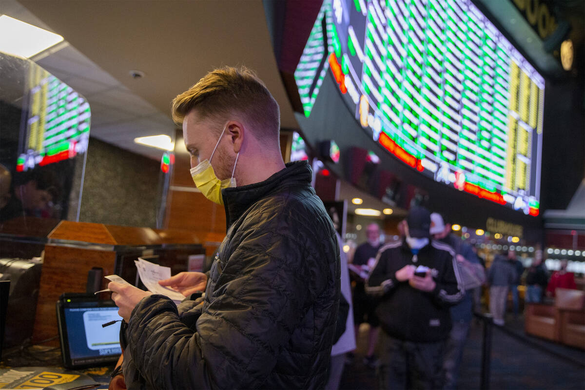 Rufus Peabody, of Las Vegas, places a Super Bowl prop bet minutes after they are released on th ...