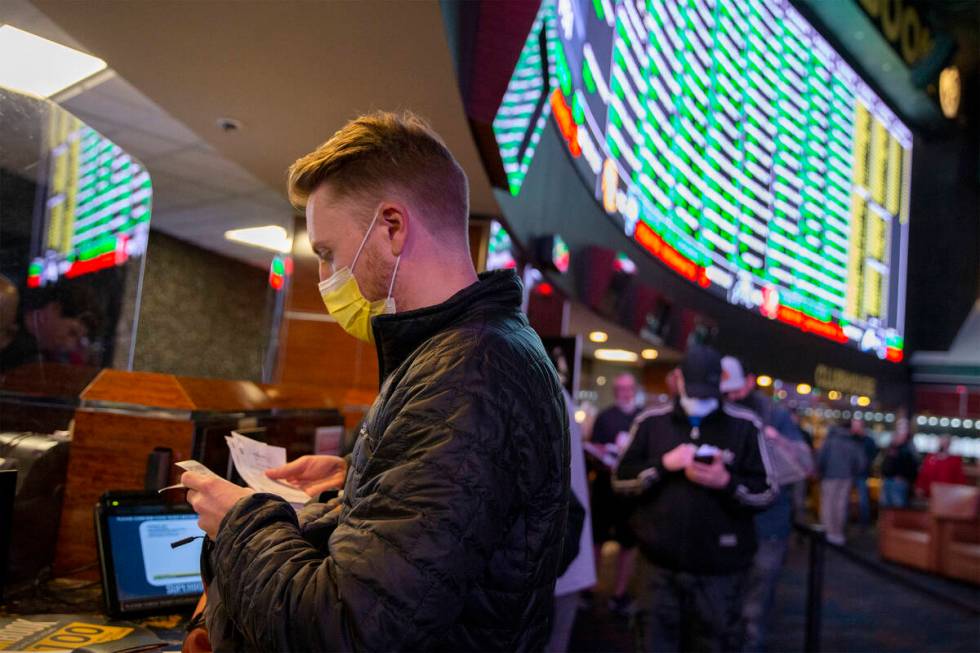 Rufus Peabody, of Las Vegas, places a Super Bowl prop bet minutes after they are released on th ...