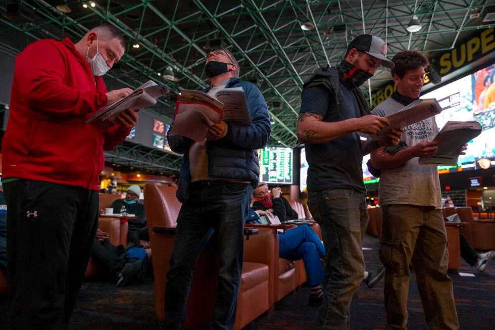 Bettors wait in line to place Super Bowl prop bets on the first night they are released on the ...