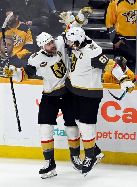 Vegas Golden Knights defenseman Alex Pietrangelo (7) celebrates with right wing Mark Stone (61) ...