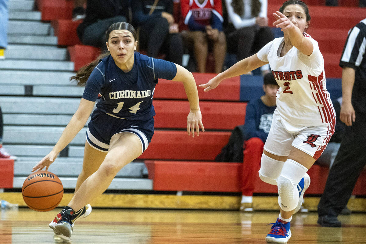 Coronado guard Kaylee Walters (14) dribbles past Liberty guard Isabella Jaramillo (2) during th ...