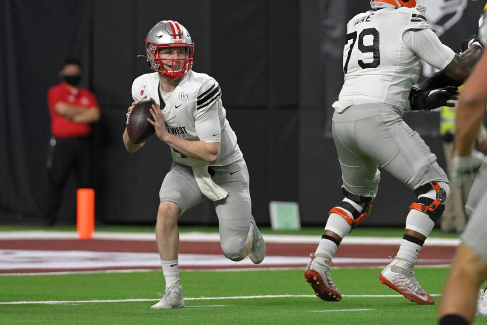 East quarterback EJ Perry (4), of Brown, looks to pass during the second half of the East-West ...