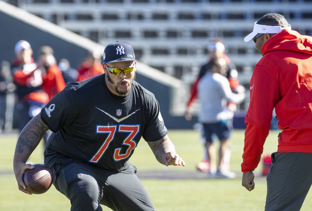 Buffalo Bills Dion Dawkins (73) makes a move on a coach during the AFC Pro Bowl players practic ...