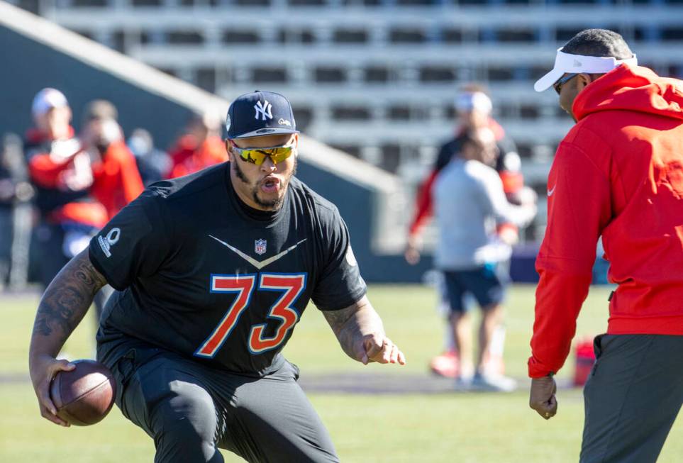 Buffalo Bills Dion Dawkins (73) makes a move on a coach during the AFC Pro Bowl players practic ...