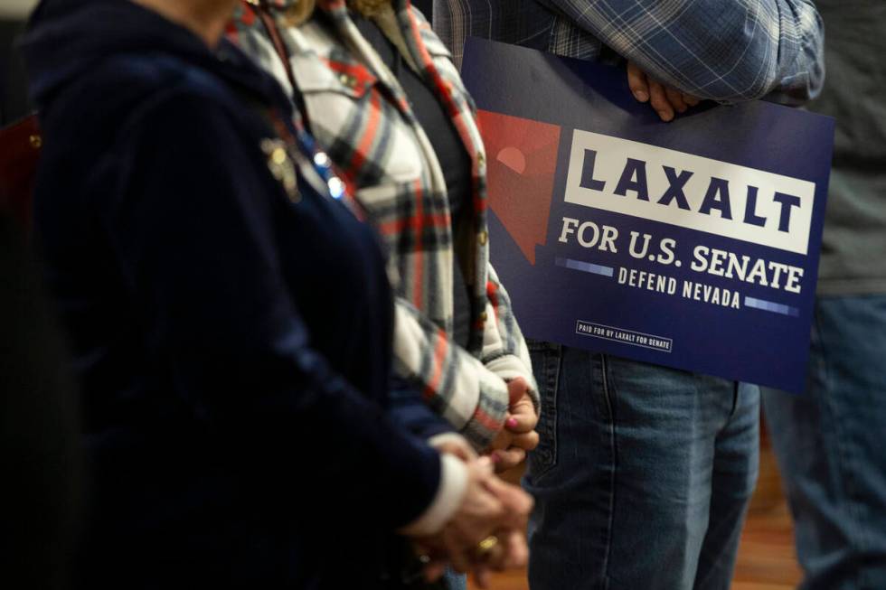 Attendees listen to speakers during a campaign event for Republican U.S. Senate candidate Adam ...