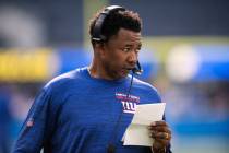 FILE - New York Giants defensive coordinator Patrick Graham stands on the field before the team ...