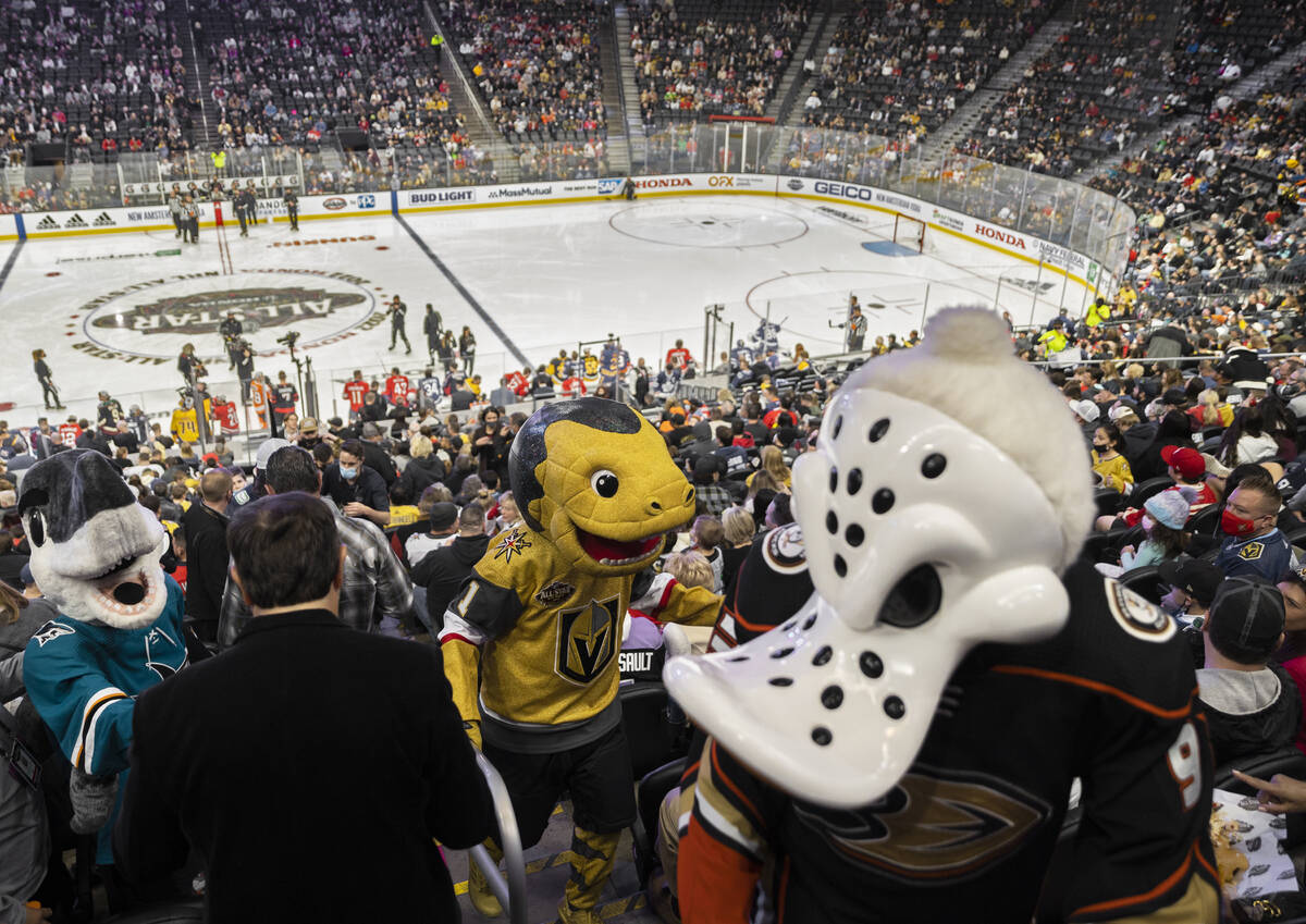 Golden Knights mascot Chance, middle, entertains the crowd during the NHL All-Star skills compe ...