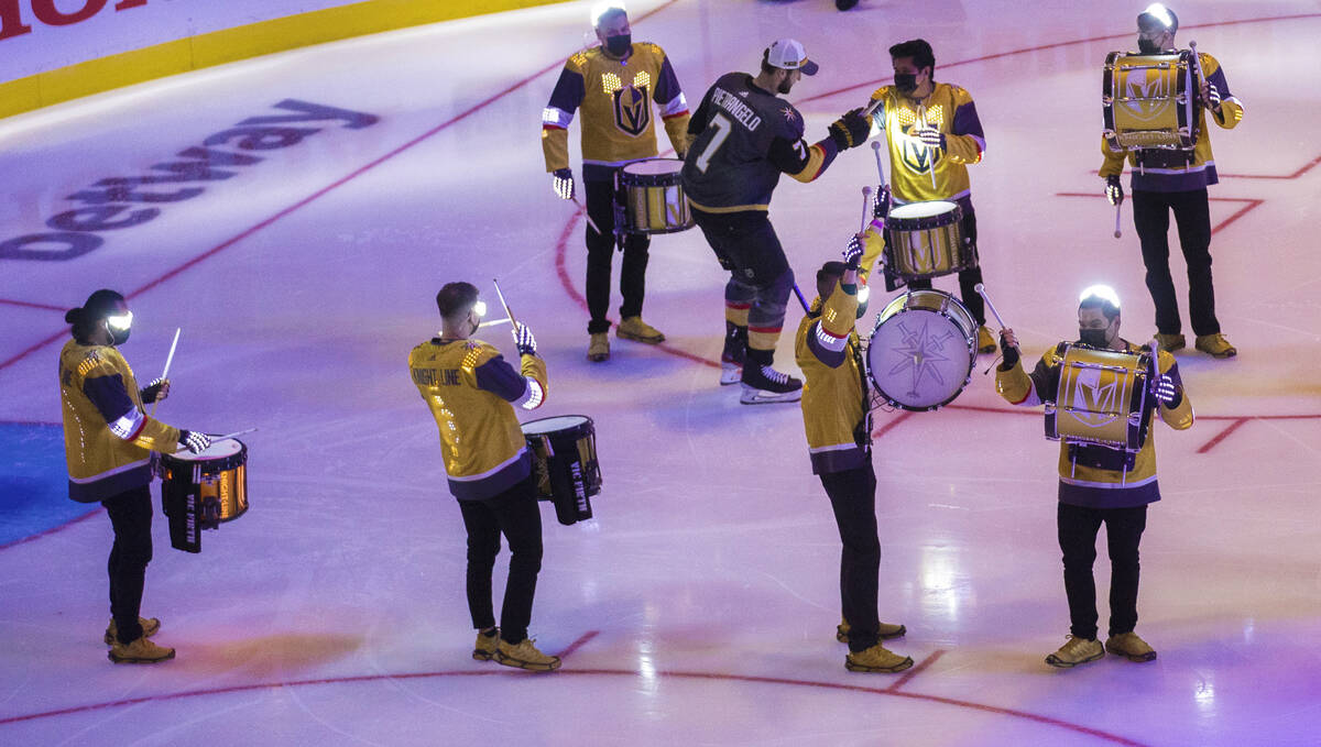 Golden Knights defenseman Alex Pietrangelo (7) celebrates with the Drumbots LED Drummers during ...