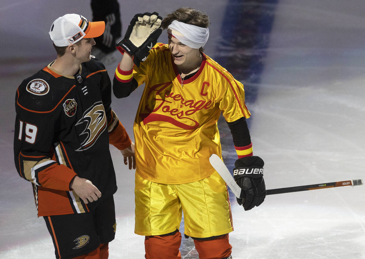 Anaheim Ducks center Trevor Zegras, right, celebrates with teammate Troy Terry (19) during the ...