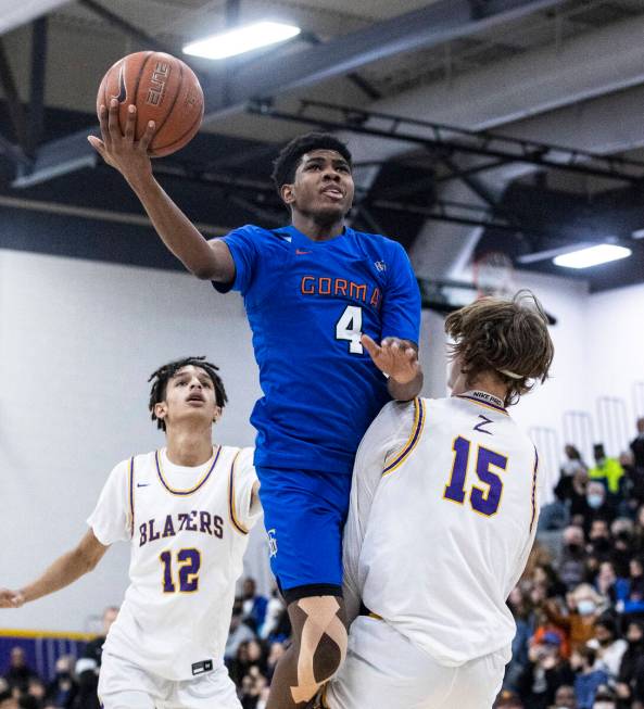 Bishop Gorman’s Jason Richardson (4) goes for the hoop between Durango high’s Mas ...