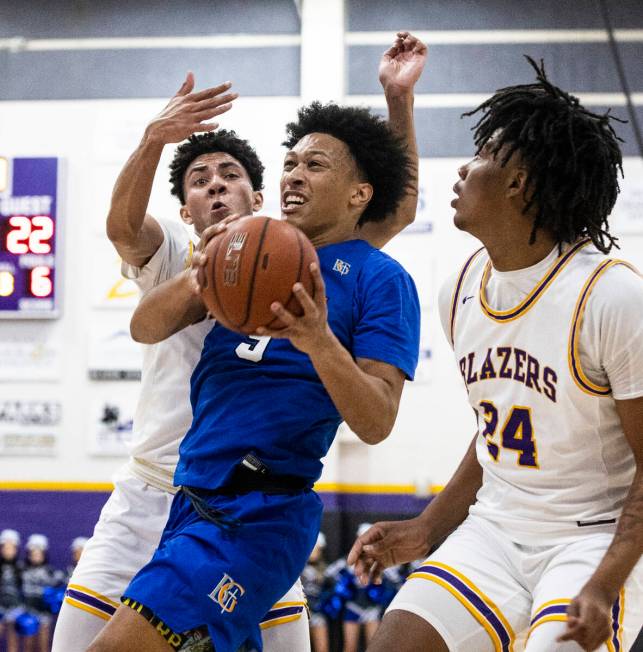 Bishop Gorman’s Darrion Williams (5) drives between Durango High’s Shane Thomas ( ...