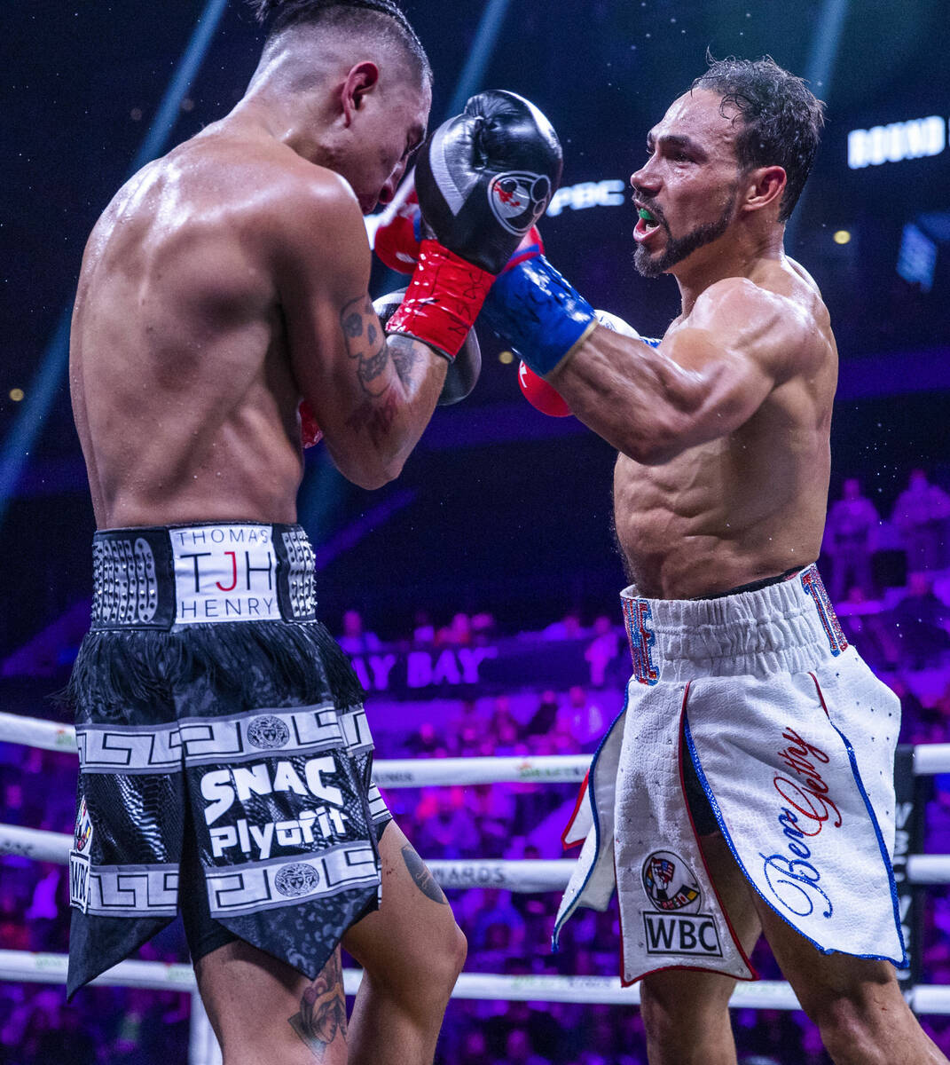 Mario Barrios, left, takes a punch to the face from Keith Thurman during the eighth round of th ...