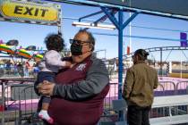 Mario Berlanga, owner of Mario’s Market in the Historic Westside, holds his granddaughter, Rh ...
