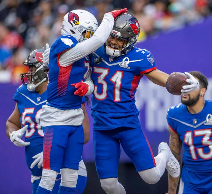 NFC strong safety Budda Baker of the Arizona Cardinals (3) celebrates an interception with NFC ...