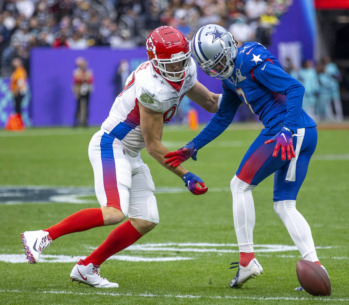 AFC tackle Travis Kelce of the Kansas City Chiefs (87) slaps the ball away for a fumble after a ...