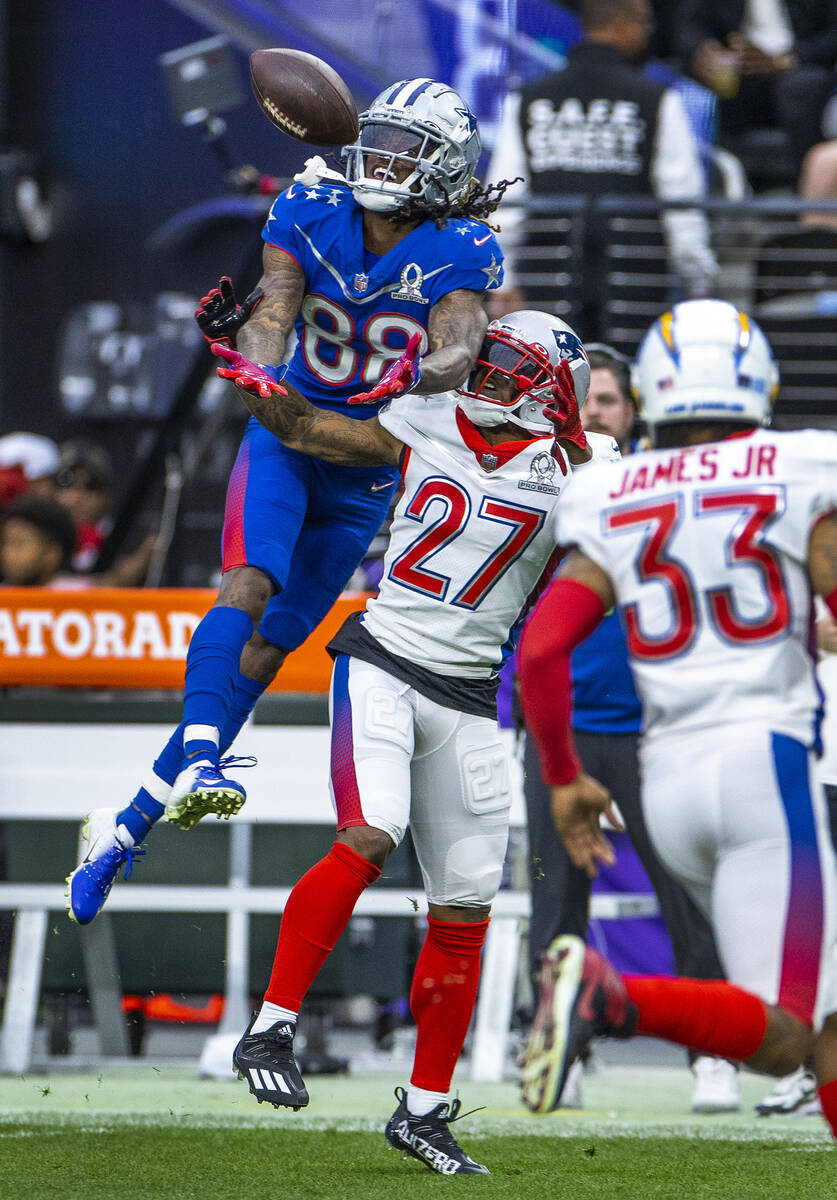 NFC wide receiver CeeDee Lamb of the Dallas Cowboys (88) elevates for a long pass as AFC corner ...