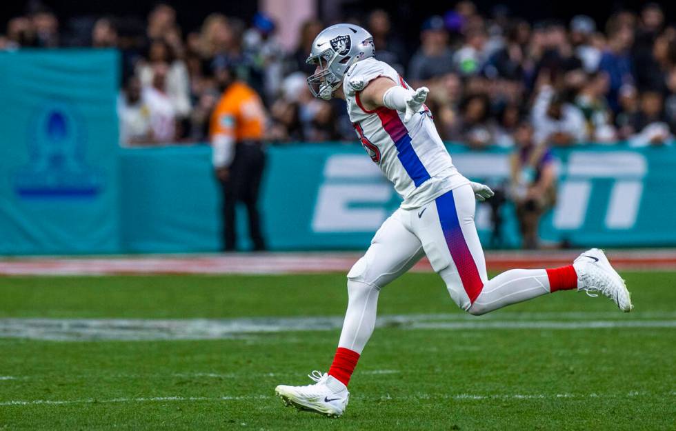 AFC defensive end Maxx Crosby of the Las Vegas Raiders (98) celebrates a sack on NFC quarterbac ...