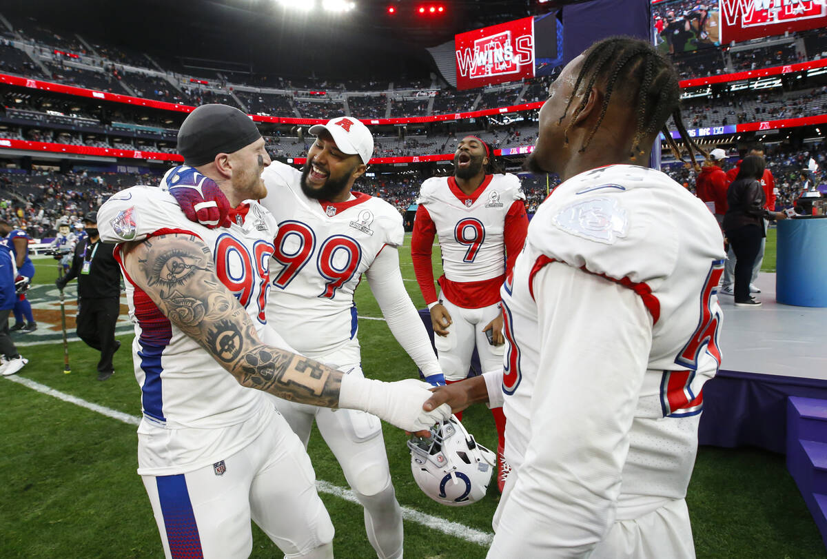 AFC defensive end Maxx Crosby of the Las Vegas Raiders (98), who was named defensive MVP, celeb ...