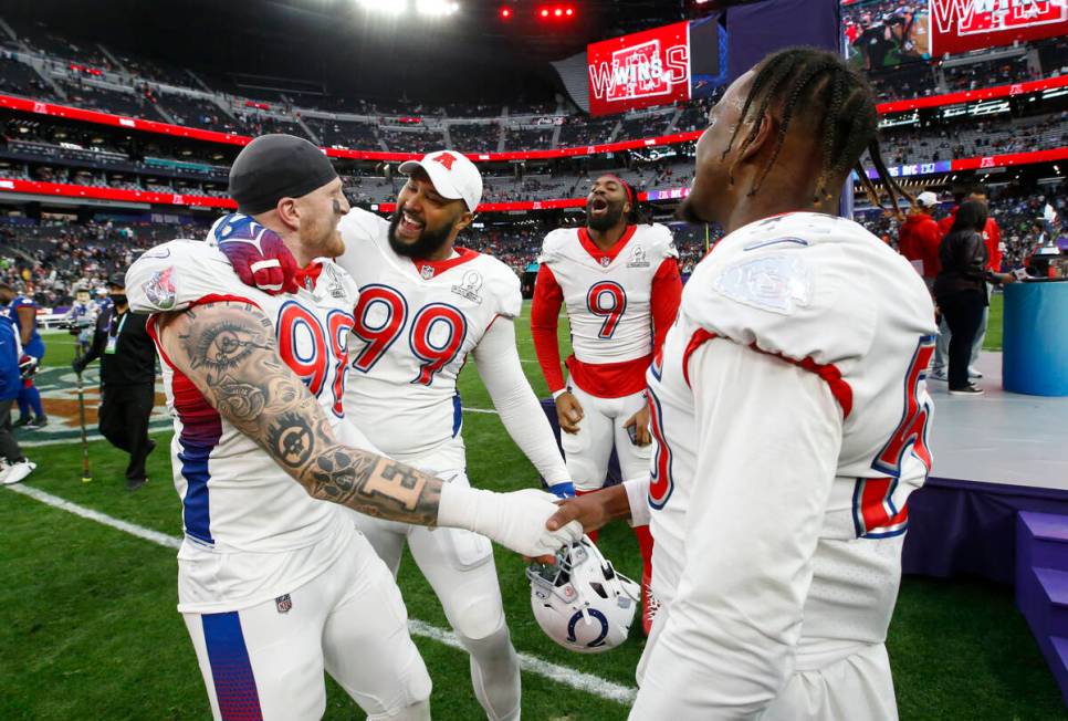 AFC defensive end Maxx Crosby of the Las Vegas Raiders (98), who was named defensive MVP, celeb ...