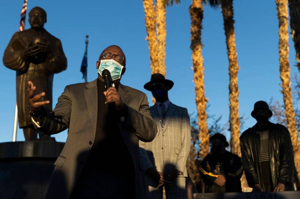 Pastor Kelcey West, left, delivers the opening prayer during an event honoring the victims of t ...