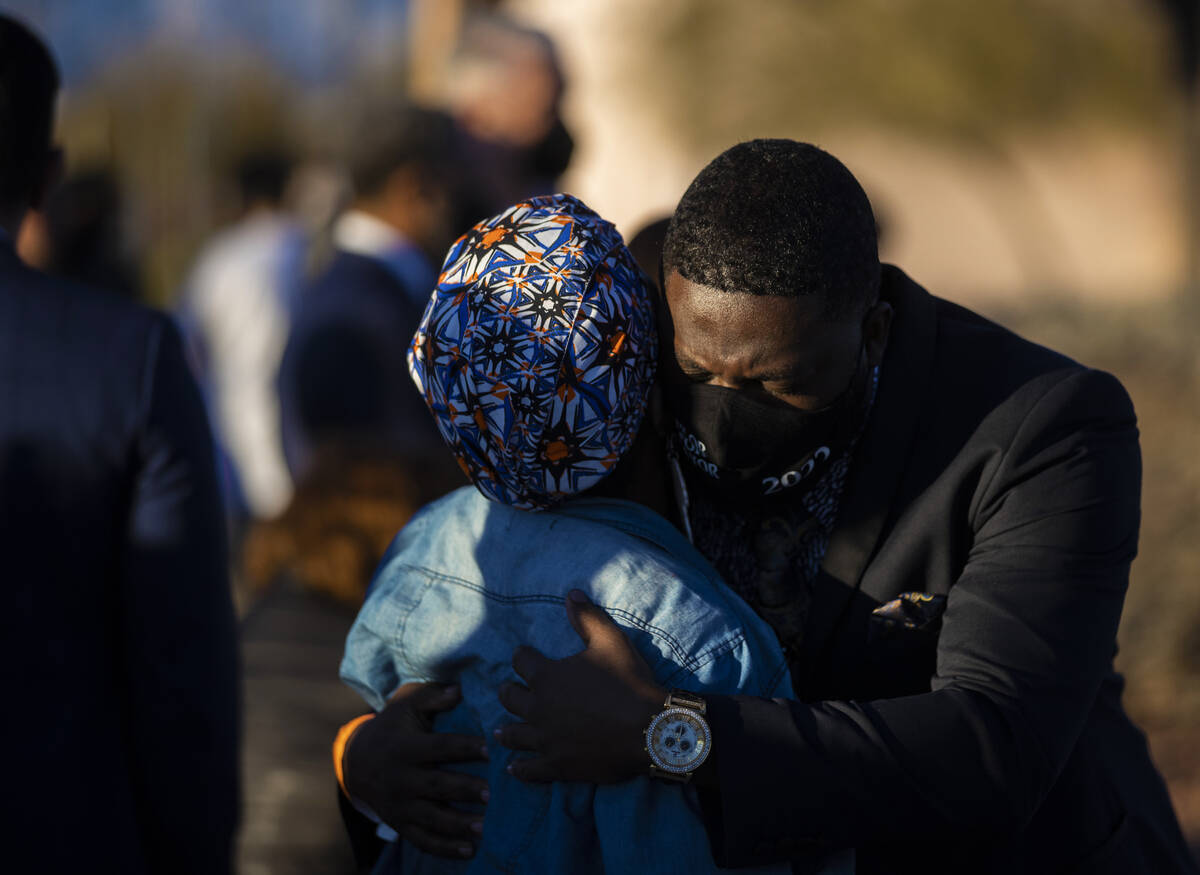 North Las Vegas mayoral candidate Robert Taylor, right, hugs a friend during an event honoring ...