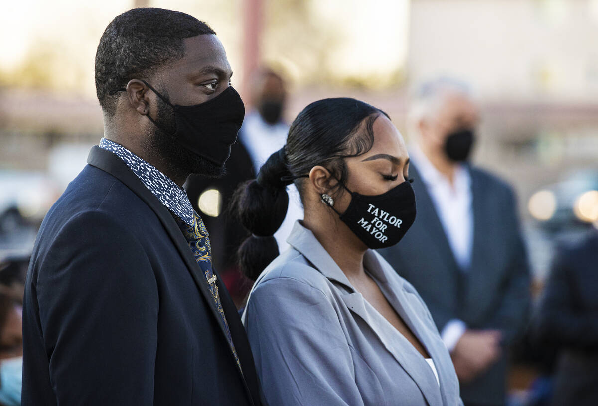 North Las Vegas mayoral candidate Robert Taylor, left, listens to a speaker during an event hon ...