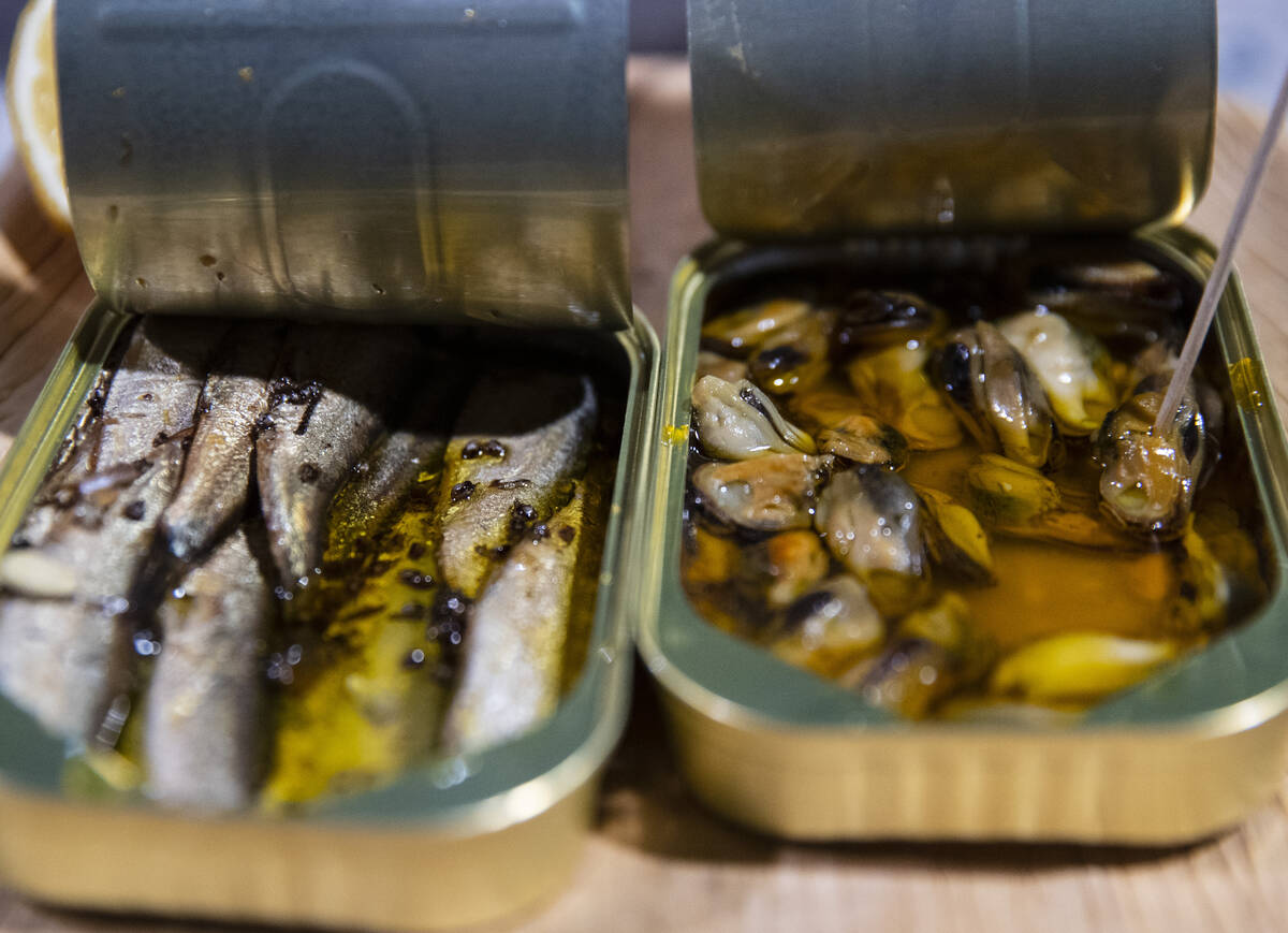 Basic sea sprat, left, and Limfjord blue mussels, marinated with dill and fennel seeds, are dis ...