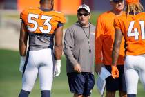 Denver Broncos special teams coordinator Tom McMahon, center, takes part in drills during NFL ...