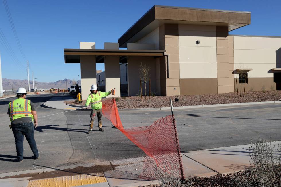 Workers put finishing touches at the Reality Based Training Center, that will prepare first res ...