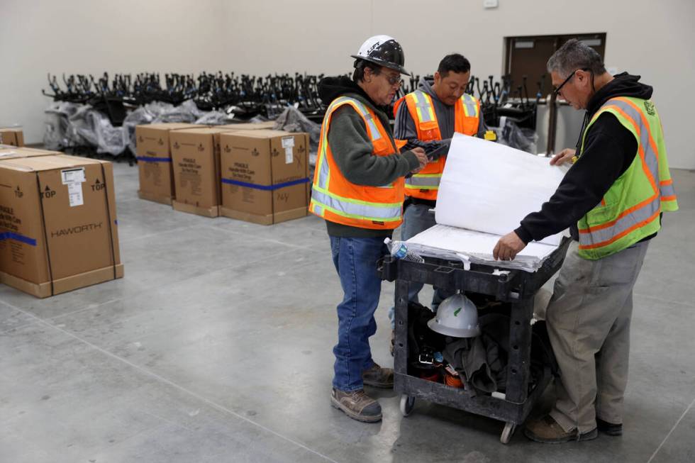 Workers put finishing touches at the Reality Based Training Center, that will prepare first res ...