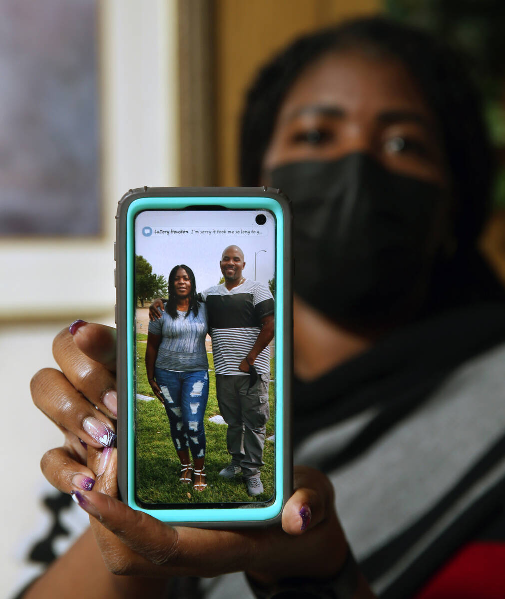 LaShonda Warfield shows a photo a her and her brother Tanaga Miller, Tuesday, Feb. 8, 2022, in ...