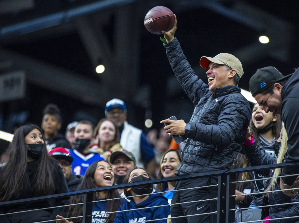 A fan celebrates receiving game ball during the first half of the Pro Bowl at Allegiant Stadium ...