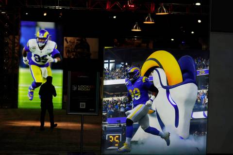 Images of Los Angeles Rams defensive end Aaron Donald are displayed inside the NFL Experience, ...