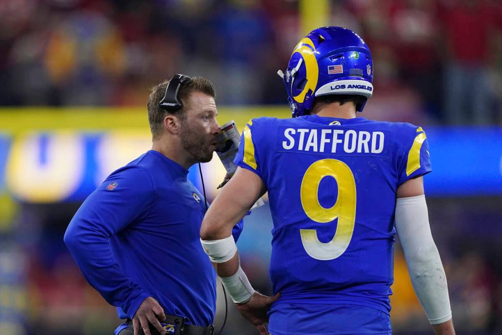 Los Angeles Rams head coach Sean McVay talks with quarterback Matthew Stafford (9) against the ...