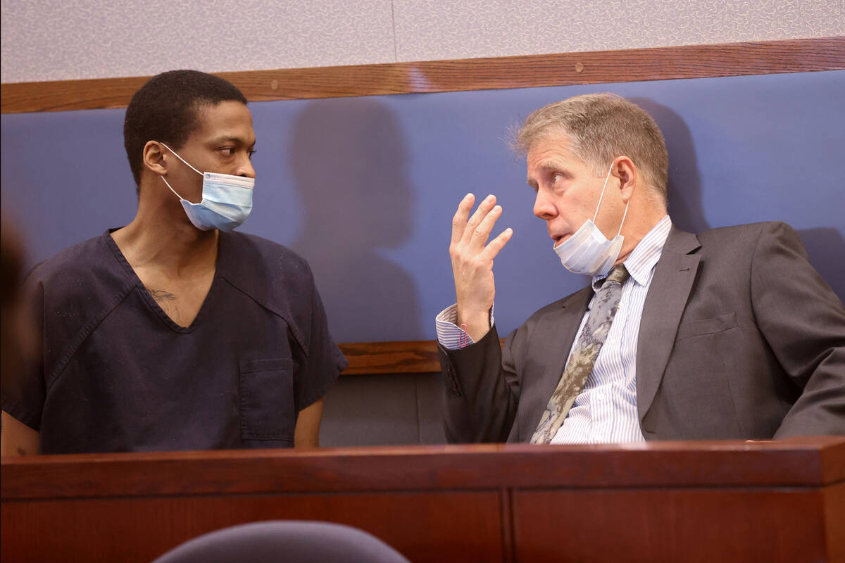 Marcas Crowley, left, talks to his attorney Craig Mueller in court at the Regional Justice Cent ...