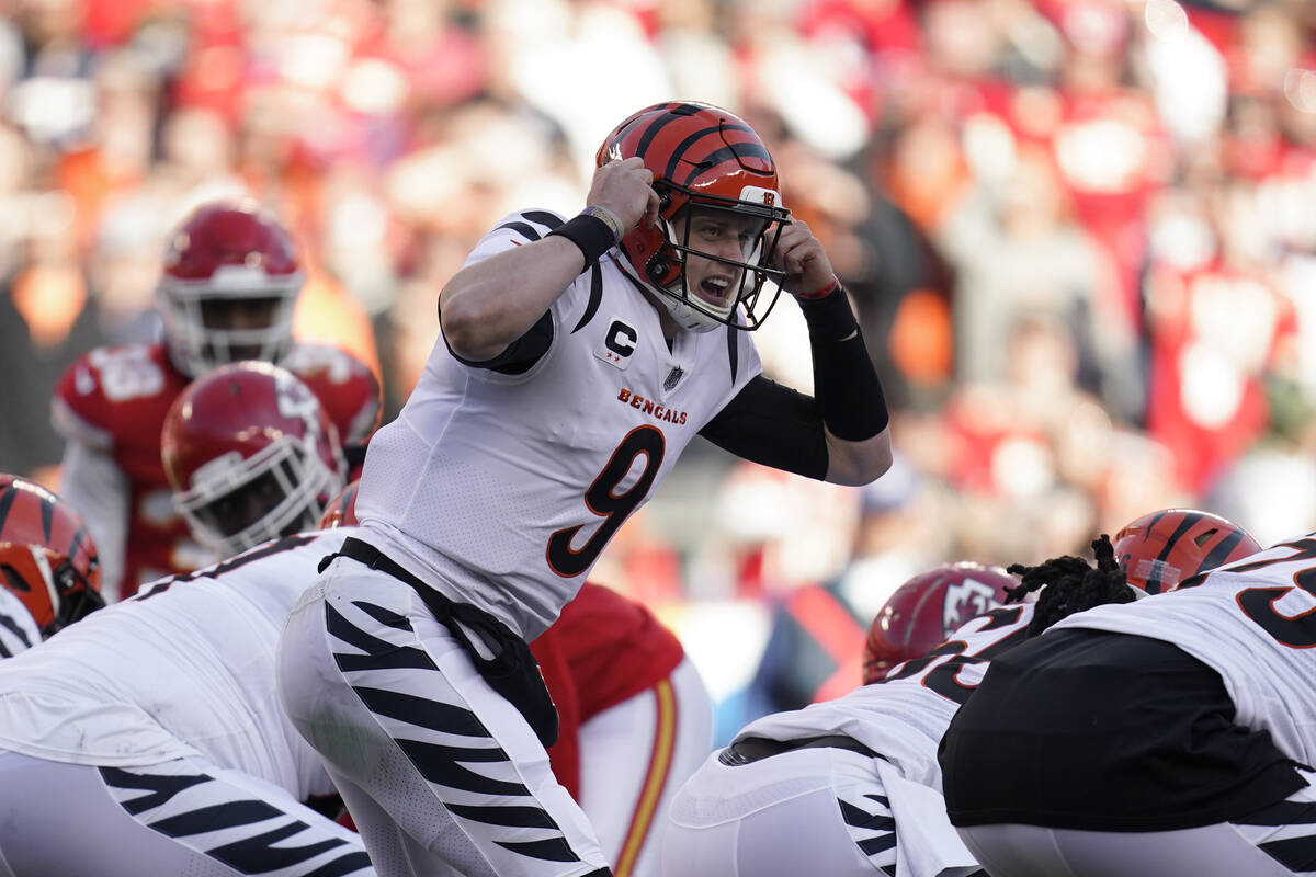 Cincinnati Bengals quarterback Joe Burrow signals during the AFC championship NFL football game ...