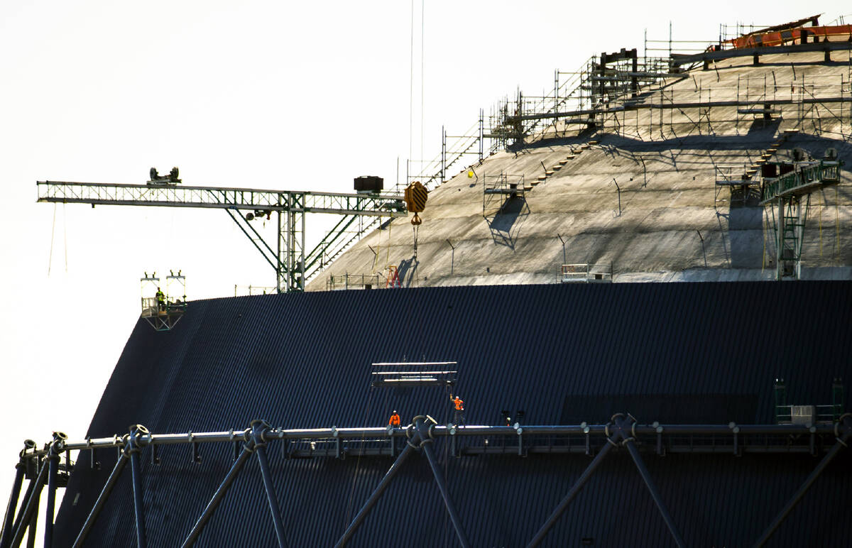 A construction crew looks up as more steel is being lifted to them at the MSG Sphere at The Ven ...