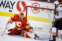 Vegas Golden Knights' Nicolas Roy, right, looks on as Calgary Flames goalie Jacob Markstrom kic ...