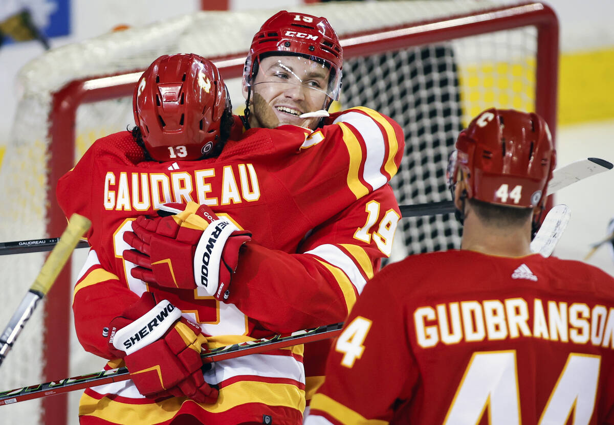 Calgary Flames' Johnny Gaudreau, left, celebrates his goal with teammate Matthew Tkachuk during ...