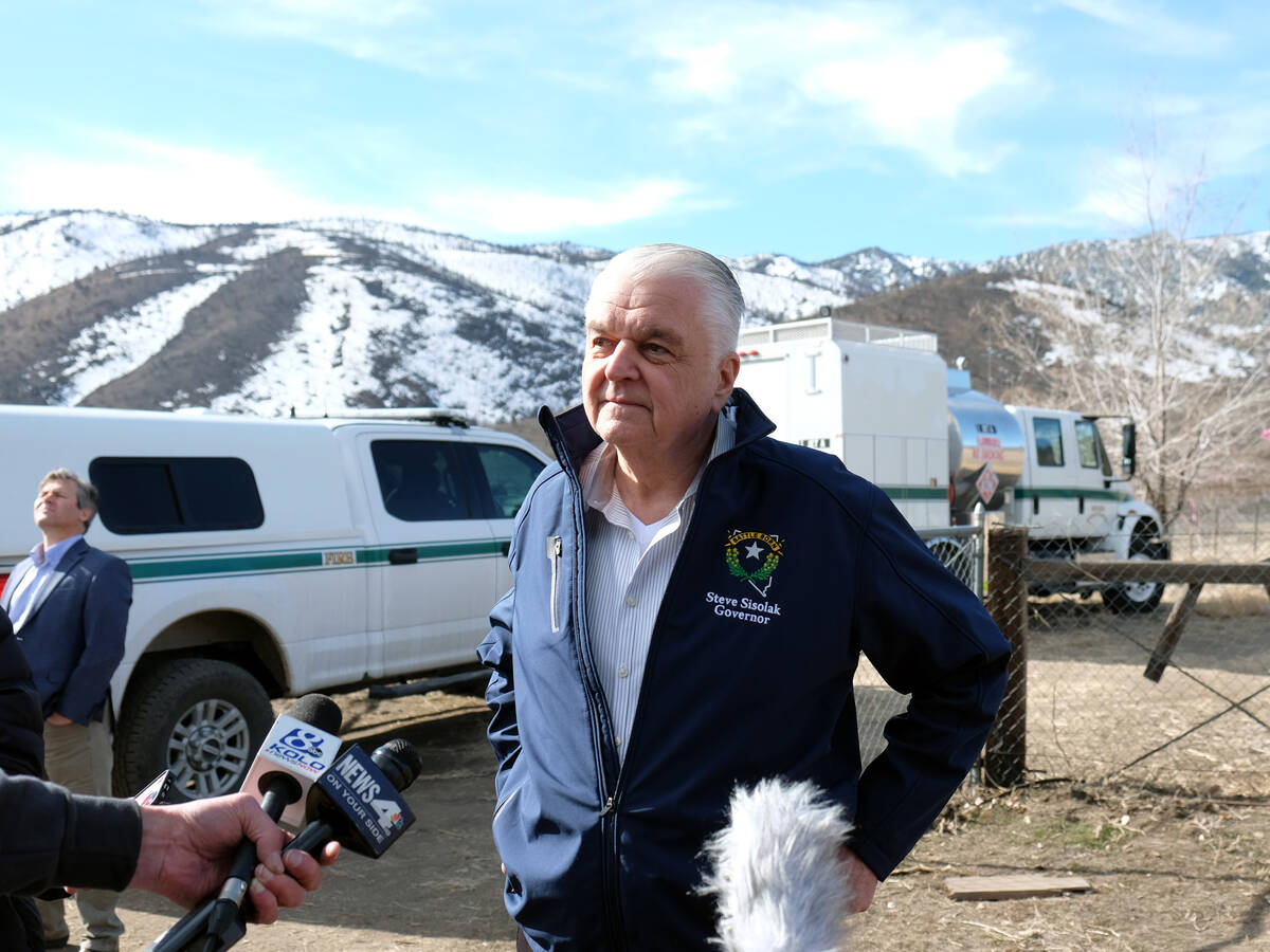 Gov. Steve Sisolak speaks to reporters after getting a briefing on reseeding efforts on lands s ...
