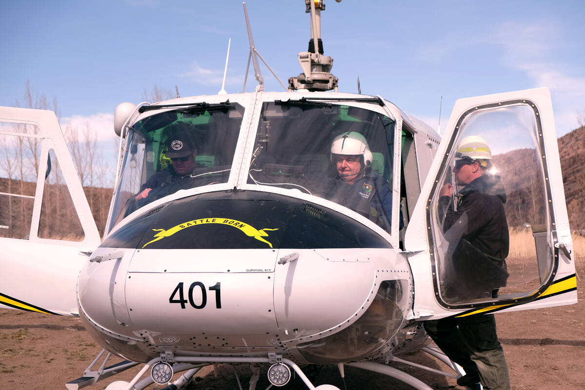 Gov. Steve Sisolak in the cockpit as a reseeding helicopter prepares to take off. February 9, 2 ...